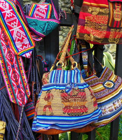 Colorful souvenirs bags and belts made of textiles with a traditional ornaments of Peruの写真素材
