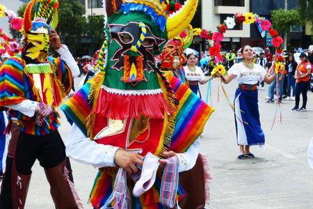 Cuenca, Ecuador - November 1, 2019: Dancers dressed in masks as characters of Inti Raymi celebration...