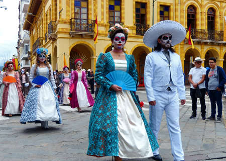 Cuenca, Ecuador - November 5, 2019: Traditional parade on day of independence of Cuenca. Couple  has dreadful face makeup as Zombieのeditorial素材