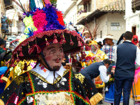 Cuenca, Ecuador - December 24, 2019: Christmas parade Pase del Nino Viajero (Traveling Child) in honor of baby Jesus. Folklore personage of Ecuador as participants of paradeのeditorial素材