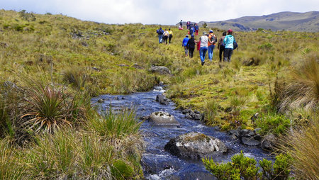 Azuay province, Ecuador - December 12, 2020: Unidentified tourists on the footpath along the mountain river at Cajas National Park, ecuadorian Andesのeditorial素材