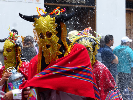 Cuenca, Ecuador - February 22, 2020: Carnival parade in Cuenca city.  Participants as characters of Inti Raymi celebration called Diablo Huma (Devil)のeditorial素材
