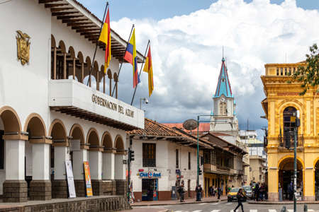 Cuenca, Ecuador - January 12, 2022: Historical center of city Cuenca. View at the street Simon Bolivar, historical buildings, Azuay province government and church San Alfonso. UNESCO heritage siteのeditorial素材