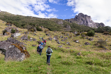 Azuay, Ecuador - May 29, 2022: Tourist on hiking trail to mountain San Pablo next to lake Busa in canton San Fernando of Azuay province, Ecuador. Popular place for tourist activityのeditorial素材