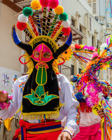 Cuenca, Ecuador - February 26, 2022: The carnival parade in Cuenca. Dancer dressed as folk character called Diablo Huma (Devil)のeditorial素材