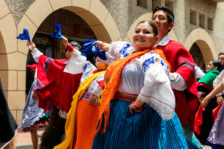 Cuenca, Ecuador - February 26, 2022: Carnival parade in Cuenca. Folk dancers from Cayambe at historic center of Cuenca city.のeditorial素材