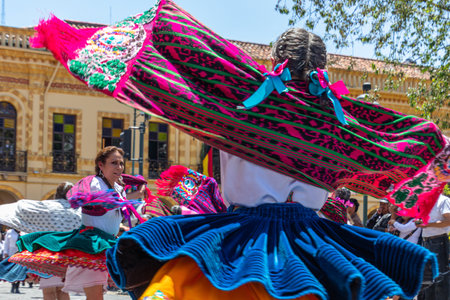 Cuenca, Ecuador - November 5, 2022: Folk dancers of Azuay province in traditional dress as "cuencanas" in the parade on the day of celebration of the Cuenca's independence dayのeditorial素材