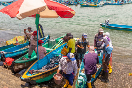 Santa Rosa, Ecuador - March 24, 2023: Santa Rosa fish market. Artisanal fishermen return home after...