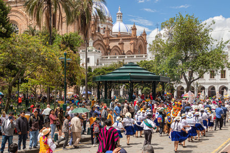 Cuenca, Ecuador - January 14, 2023: Big parade "Pase del NiÃ±o Viajero" celebration. A group of folk dancers from Azuay Province in colorful traditional dress in historical center oのeditorial素材