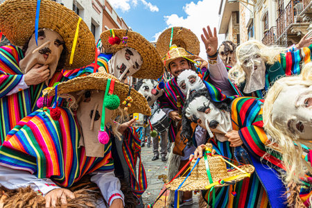 Cuenca, Ecuador - December 24, 2022: Pase del NiÃ±o Viajero Christmas Parade in Cuenca. A cheerful group of participants dressed as folk characters.のeditorial素材