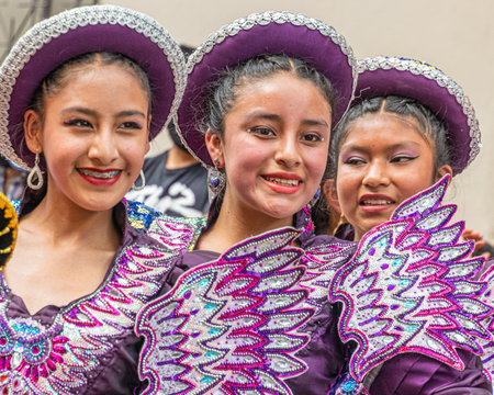 Cuenca, Ecuador - December 24, 2022: Pase del NiÃ±o Viajero Christmas procession in Cuenca. UNESCO cultural heritage. Young beautiful women Bolivian dancersのeditorial素材