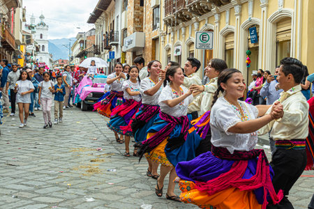 Cuenca, Ecuador -December 24, 2022: Pase del NiÃ±o Viajero Christmas procession in Cuenca. UNESCO cultural heritage. Folk dancers of Azuay province in the historical center of cityのeditorial素材