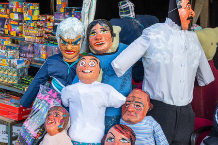 Cuenca, Ecuador-December 29, 2022: Rag dolls or dummies with funny, comedic or political masks are sold at the market for Monigotes. They will be burned at New Year midnightのeditorial素材