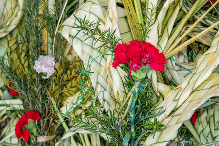 Holy Week. Traditional Catholic celebrate Palm Sunday. Decorative Palm Sunday bouquets sold on Flower market in Cuenca. Palm sunday background.の写真素材