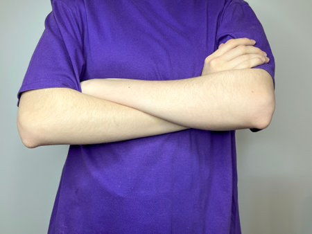 hands folded on the chest closed pose in psychologyの写真素材