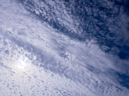 white fluffy clouds in the blue morning sky