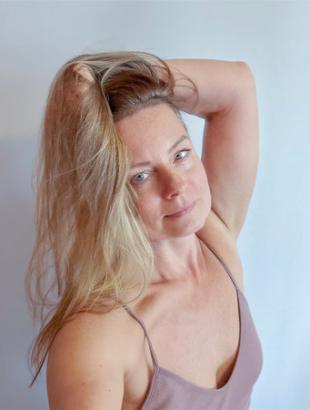 portrait of a 50-year-old woman with long blonde hairの写真素材