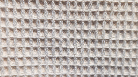 High-detail macro shot of grey waffle weave linen fabric