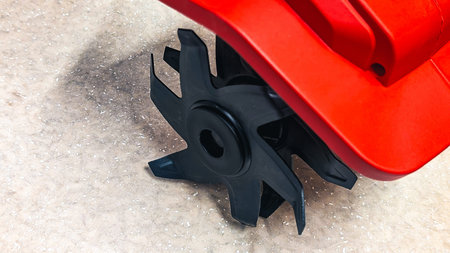 Black star-shaped tiller blade attachment for soil cultivation