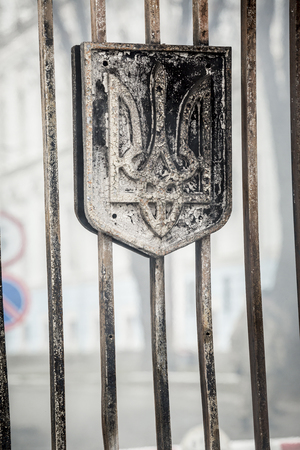 Kiev, Ukraine - 02 February 2015: Burned coat of arms of Ukraine as a symbol at the entrance of the General Staff of the Ministry of Defense of Ukraine during a protest rally in front of Ukrainian Ministry of Defence in Kiev, Ukraine. According to local mのeditorial素材