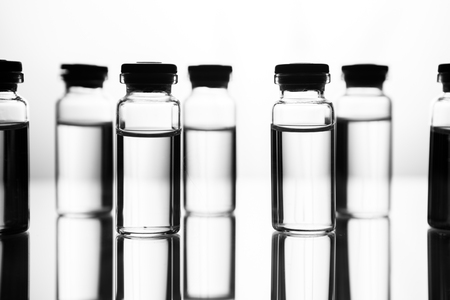 Group object of liquid medicinal agent in limpid glassware in medical laboratory. Group of ampoules with a transparent medicine in medical laboratoryの写真素材