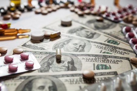 Medical marketing and healthcare business analysis report with graph and many. Pile of pills in...