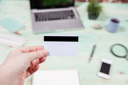 A man is going to pay for the goods in the internet using credit card and laptop computer. Online shopping concept.の写真素材