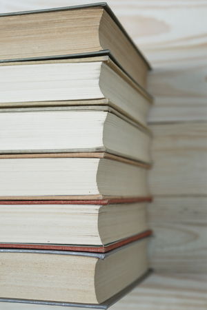 Pile of old books stacked on top of each other. Selective focus with copy spaceの写真素材