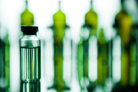 Group object of liquid medicinal agent in limpid glassware in medical laboratory. Group of ampoules with a transparent medicine in medical laboratoryの写真素材
