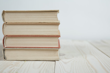 Pile of old books stacked on top of each other. Selective focus with copy spaceの写真素材