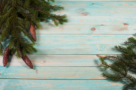Christmas background with spruce branches on wooden board with copy spaceの写真素材