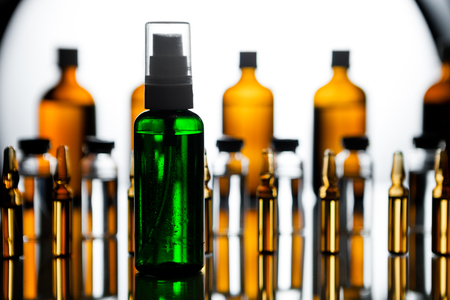 Group object of liquid medicinal agent in limpid glassware in medical laboratory. Group of ampoules with a transparent medicine in medical laboratoryの写真素材