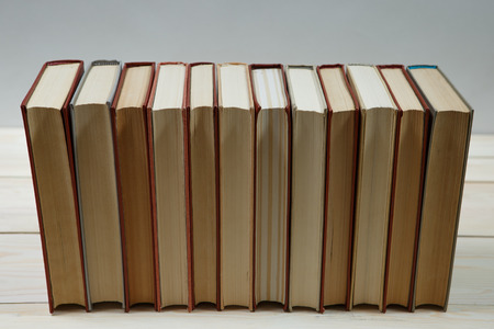 Pile of old pastel colors books stacked. Selective focus with copy spaceの写真素材