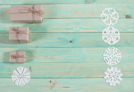 Gift boxes wrapped kraft paper tied with twine and paper snowflake and tied with twine. with copy spaceの写真素材