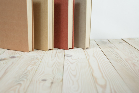 Pile of old pastel colors books stacked. Selective focus with copy spaceの写真素材