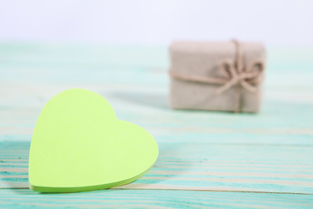 Gift boxes wrapped kraft paper tied with twine and sticker heart and tied with twine. with copy spaceの写真素材