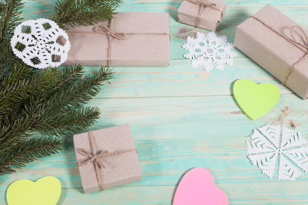 Gift boxes wrapped kraft paper tied with twine and sticker heart and tied with twine. with copy spaceの写真素材