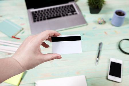 A man is going to pay for the goods in the internet using credit card and laptop computer. Online shopping concept.の写真素材