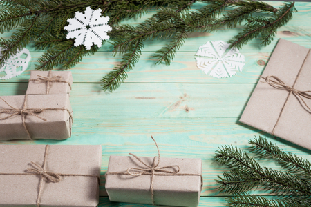Gift boxes wrapped kraft paper tied with twine and paper snowflake and tied with twine. with copy spaceの写真素材