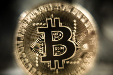 New virtual money Golden bitcoin coin on us dollars background . Cryptocurrency. Business and Trading concept. Close-up shotの写真素材
