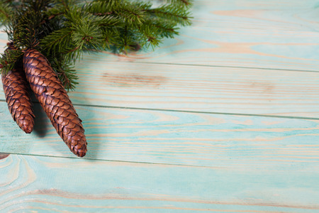 Christmas background with spruce branches on wooden board with copy spaceの写真素材
