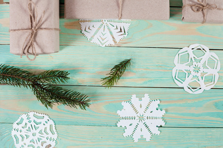 Gift boxes wrapped kraft paper tied with twine and paper snowflake and tied with twine. with copy spaceの写真素材