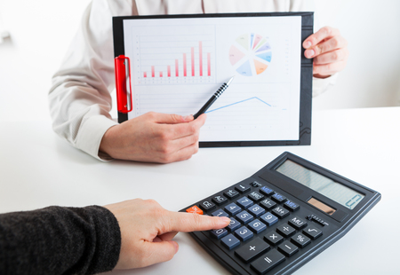 Business financier audit working with laptop and data annual report. Marketing strategy brainstorming. Paperwork and digital in office.の写真素材