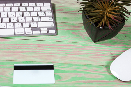 Office desk table with laptop, pen and notebook. Top view with copy space. Online shopping concept.の写真素材