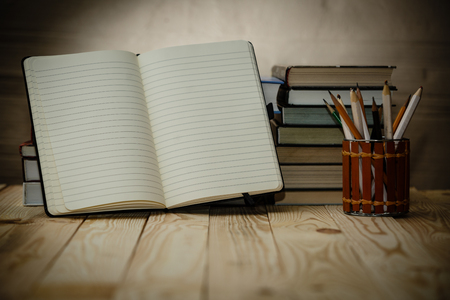 Open textbooks on wood desk with blurred focus for education background. Back to school conceptの写真素材