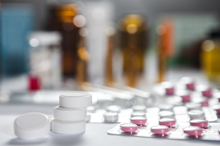 Medical marketing. Pile of pills in blister packs background. Selected focus with copy space for your text.の写真素材