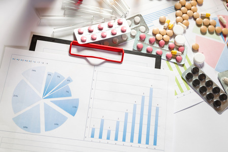 Medical marketing and Health care business analysis report. Pile of pills in blister packs backgroundの写真素材
