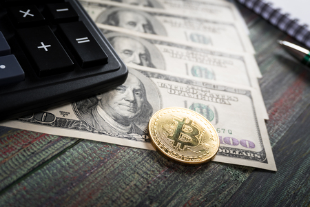 Bitcoin and keyboard calculator in a business office. Bitcoin golden coin New virtual moneyの写真素材