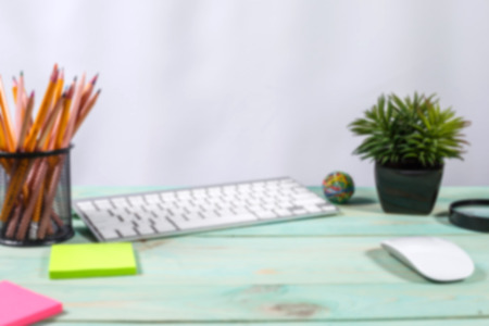 Office desk table with computer, supplies, flower and coffee cup. Copy spaceの写真素材