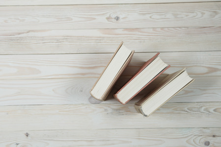 Pile of old books pastel colors stacked. Selective focus with copy spaceの写真素材